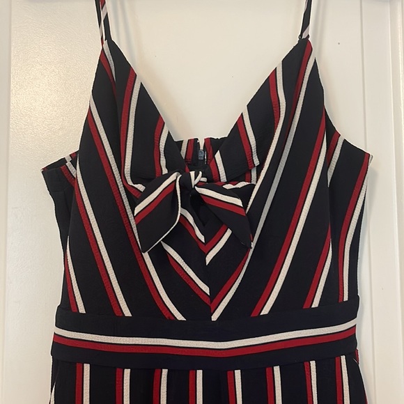 A fun and flirty navy jumpsuit with red/white accents! - Picture 3 of 3